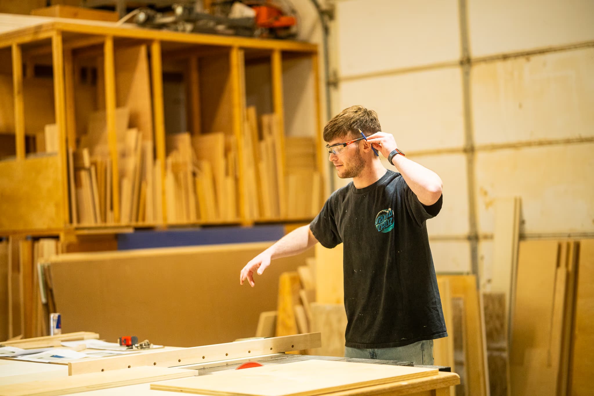 man making cuts at a table saw