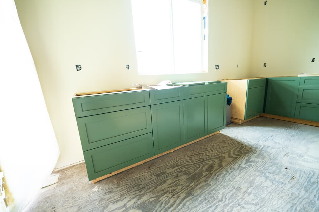 a finished kitchen remodel with a large island and custom cabinetry