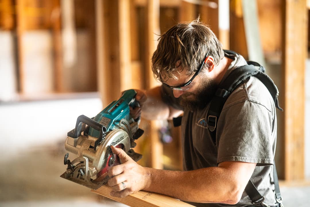 a man using a circular saw